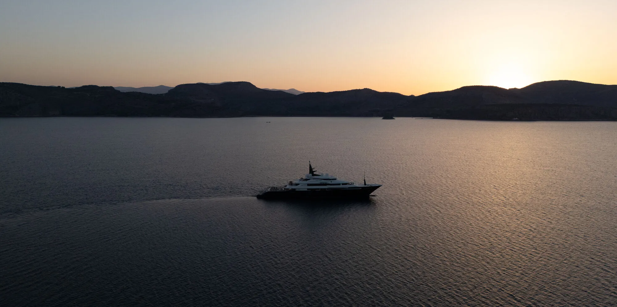 ALFA NERO at sunset, distinctive black hull silhouette by Nuvolari Lenard