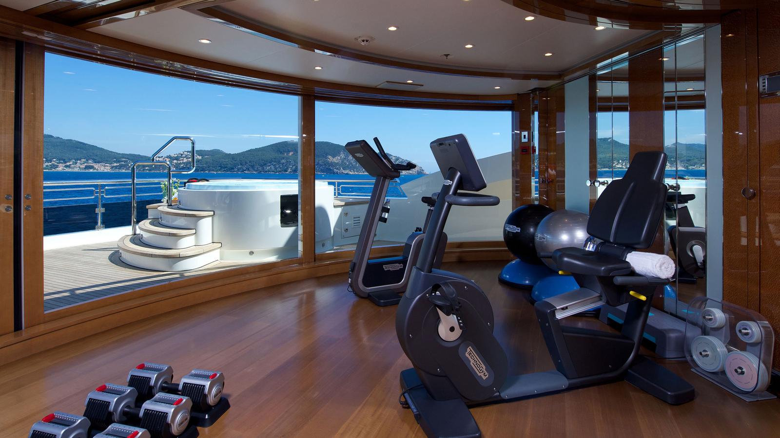 ALFA NERO Gym with panoramic ocean views and Technogym equipment